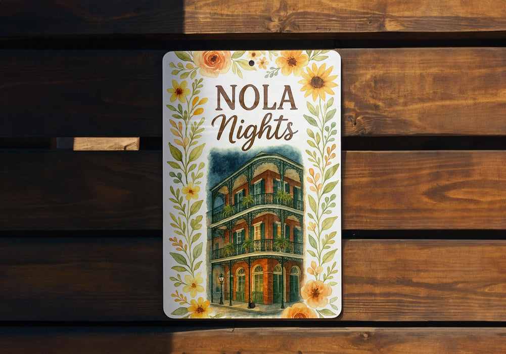 a sign on a wooden bench that says nola nights