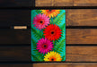 a picture of a flower on a wooden bench