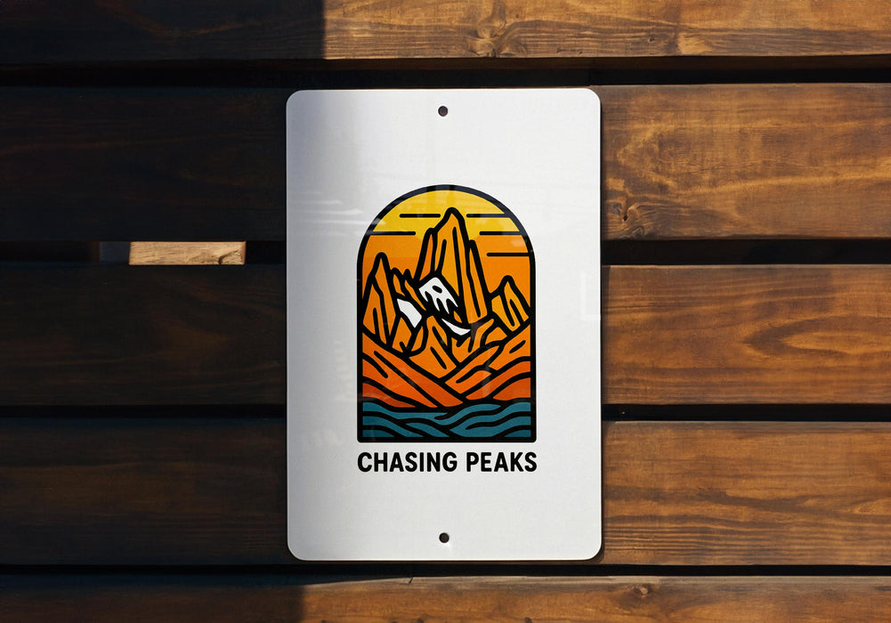 a sign on a wooden wall that says chasing peaks
