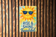 a wooden wall with a sign that says rise and shine beautiful