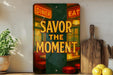 a picture of a sign that says savor the moment