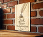 a sign that says ink your imagination on a brick wall