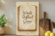 a picture of a sign that says write reflect grow