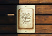 a sign that reads write reflect grow on a wooden bench