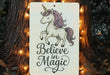 a sign that says believe in magic with a unicorn on it