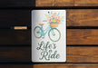 a sign that says life's a ride with a bicycle on it