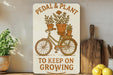 a sign that says pedal and plant to keep on growing