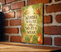 a sign on a brick wall that says, wander where the wifi is weak
