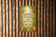 a wooden wall with a sign that says wander where the wi - fi is weak