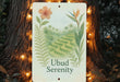 a sign that reads ubud serenity on a tree