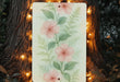 a painting of pink flowers with green leaves