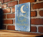 a sign that says good night, wander on a brick wall