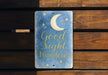 a sign that says good night wander on it