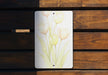 a picture of a bunch of flowers on a piece of wood