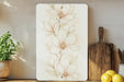 a painting of a flower on a white board