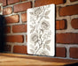 a picture of a rose on a brick wall