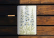 a picture of some flowers on a wooden surface