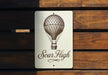 a sign on a wooden wall that says soir high