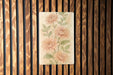 a painting of flowers on a wooden wall