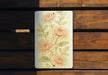 a picture of flowers on a wooden bench