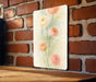 a picture of some flowers on a brick wall