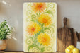 a painting of yellow flowers on a yellow background