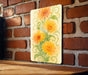 a picture of some flowers on a brick wall