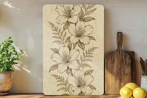 a painting of flowers on a wall next to a cutting board