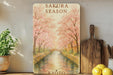 a painting of a river with trees and flowers