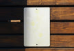 a close up of a white object on a wooden surface