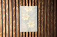 a picture hanging on a wooden wall