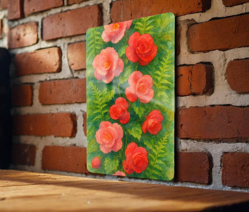 a painting of red flowers on a brick wall
