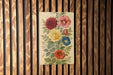 a painting of flowers on a wooden wall