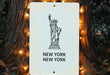 a sign with a statue of liberty on it