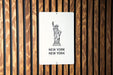 a new york sign on a wooden wall