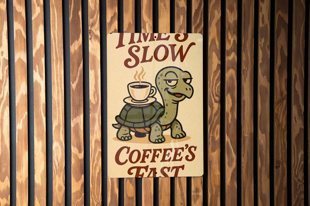 a sign on a wall that says time's slow coffee's fast