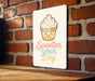 a sign that says sweeten your day on a brick wall