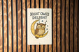 a night owl's delight sign on a wooden wall