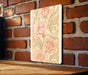 a picture of some flowers on a brick wall