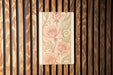 a wooden wall with a painting of flowers on it