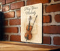 a sign that says play your melody with a violin on it