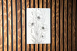 a picture of some flowers on a wooden wall