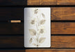 a picture of a flower on a wooden bench