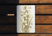 a picture of a bunch of flowers on a plaque