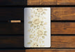 a picture of some flowers on a wooden bench