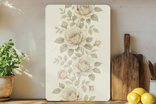 a painting of flowers on a wall next to a cutting board
