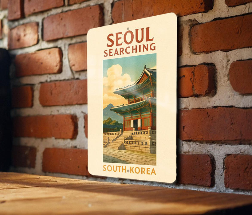 a sign on a brick wall that says seoul searching south korea