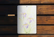 a picture of some flowers on a wooden bench