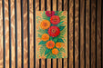 a painting of flowers on a wooden wall