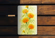 a painting of flowers on a wooden bench